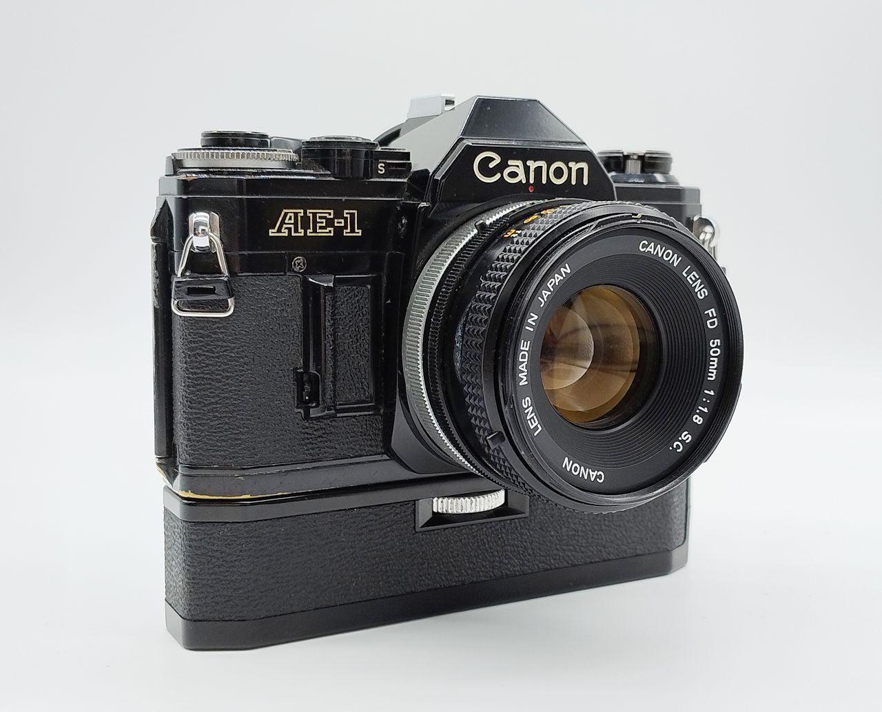 79 - Canon AE1 + Canon 50/1.8 Objektiv (vmtl. Pilz) + Motor Drive A