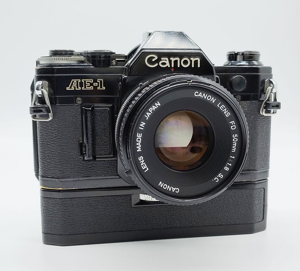 79 - Canon AE1 + Canon 50/1.8 Objektiv (vmtl. Pilz) + Motor Drive A