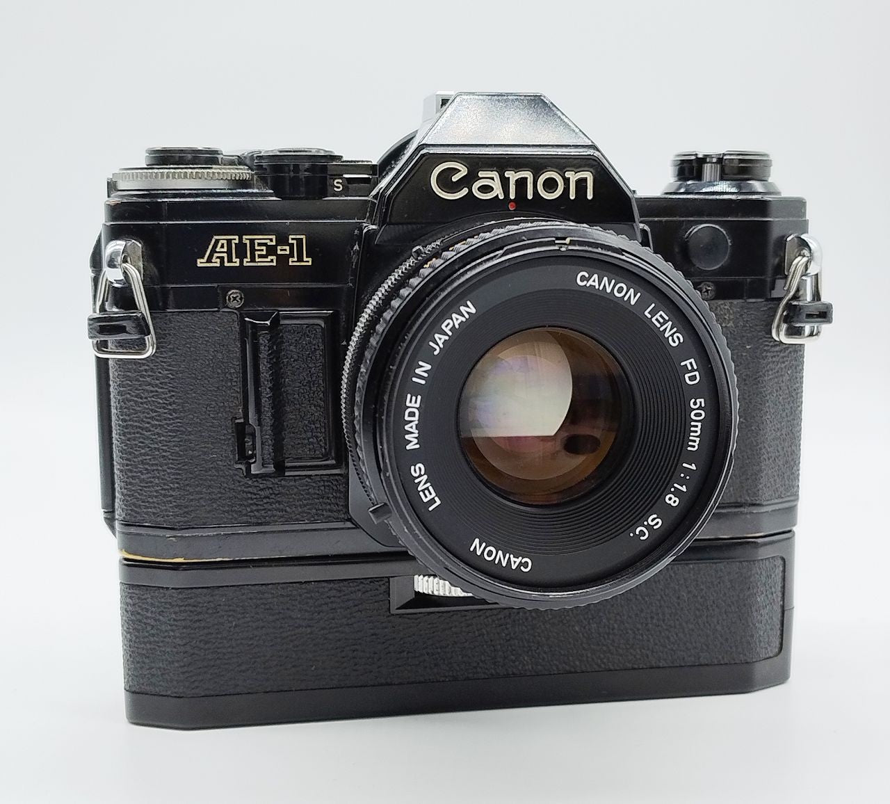 79 - Canon AE1 + Canon 50/1.8 Objektiv (vmtl. Pilz) + Motor Drive A