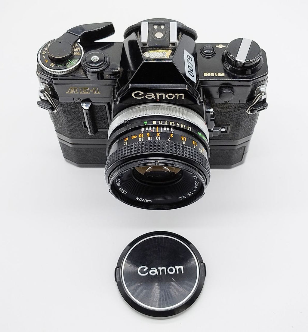 79 - Canon AE1 + Canon 50/1.8 Objektiv (vmtl. Pilz) + Motor Drive A