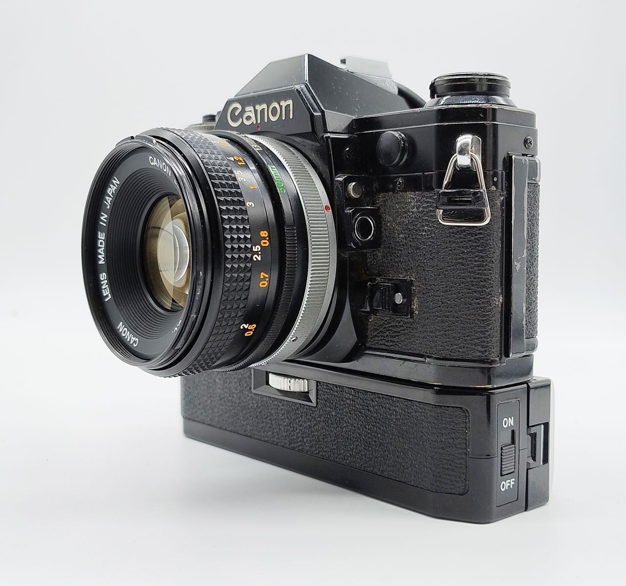 79 - Canon AE1 + Canon 50/1.8 Objektiv (vmtl. Pilz) + Motor Drive A