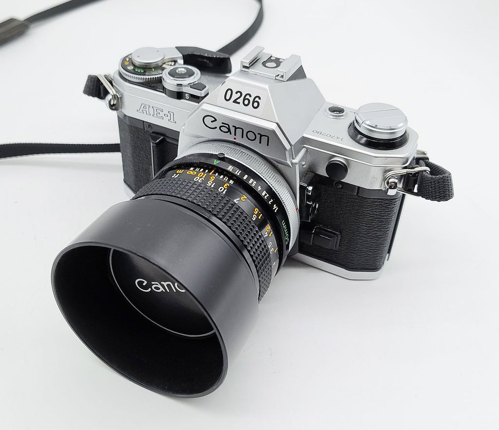 266 - Canon AE1 (läuft) + 50/1.4 FD (sehr schön +  Filter) + Karton + Anleitung