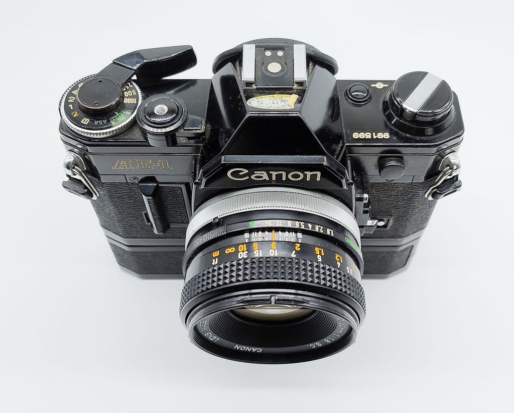 79 - Canon AE1 + Canon 50/1.8 Objektiv (vmtl. Pilz) + Motor Drive A