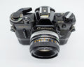 79 - Canon AE1 + Canon 50/1.8 Objektiv (vmtl. Pilz) + Motor Drive A