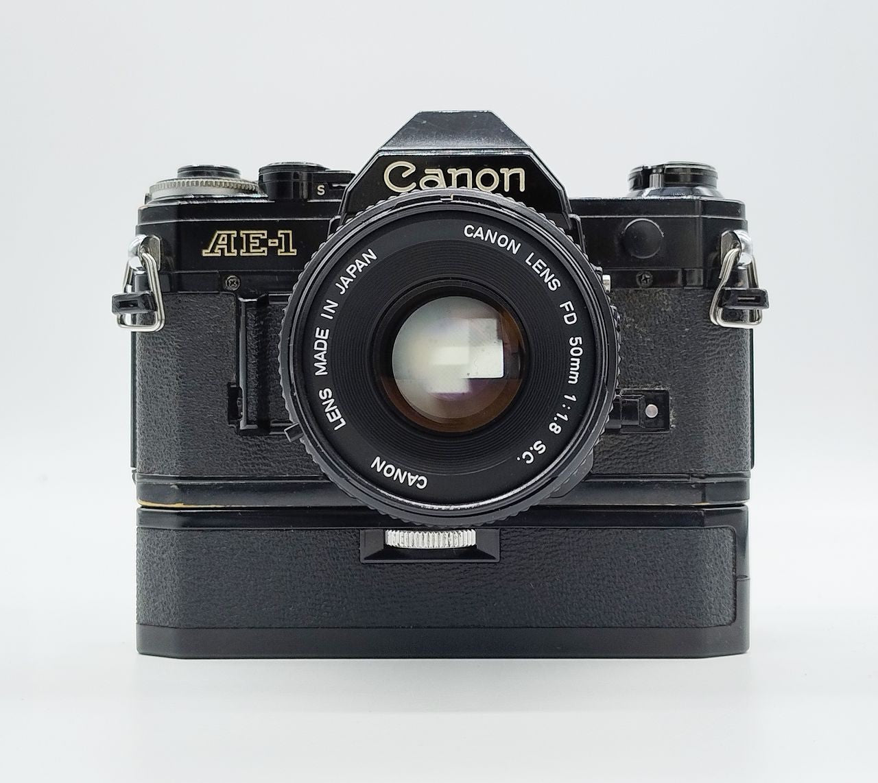 79 - Canon AE1 + Canon 50/1.8 Objektiv (vmtl. Pilz) + Motor Drive A