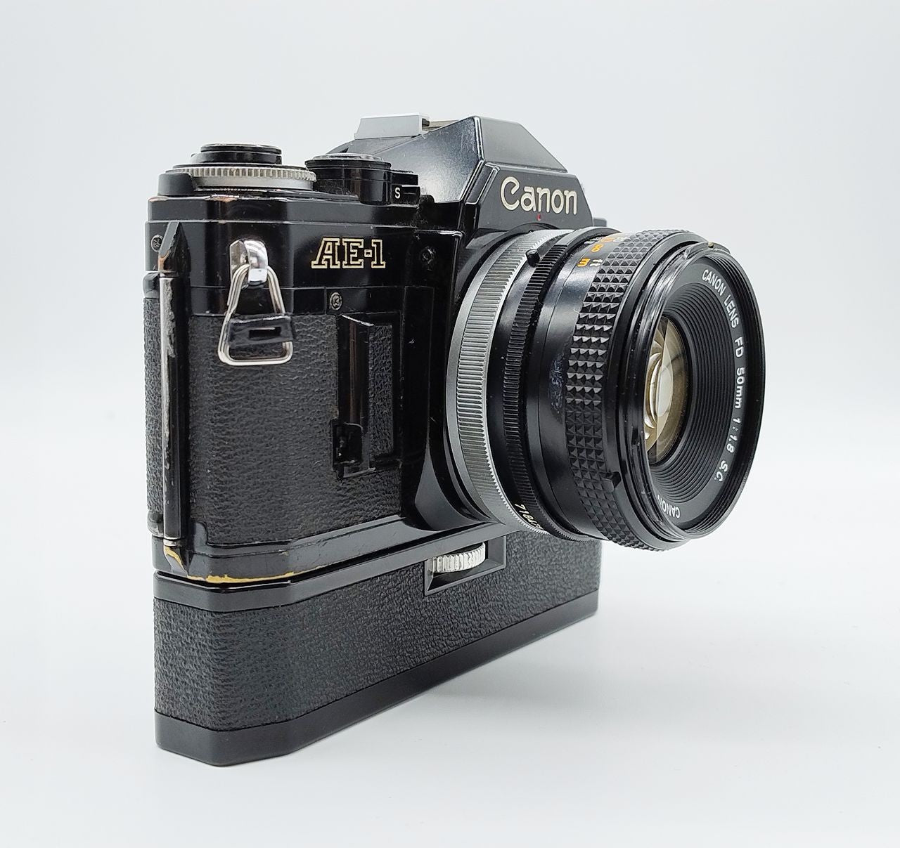 79 - Canon AE1 + Canon 50/1.8 Objektiv (vmtl. Pilz) + Motor Drive A