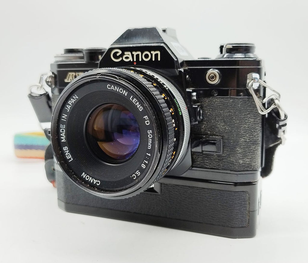 194 - Canon AE1 (schwarz) + FD 50/1.8 + Motor + alles voll funktionsfähig
