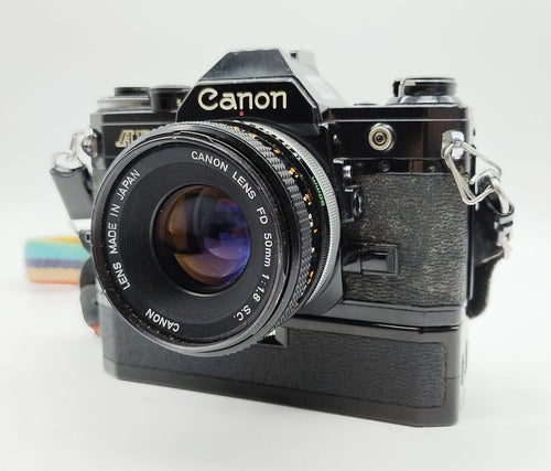 194 - Canon AE1 (schwarz) + FD 50/1.8 + Motor + alles voll funktionsfähig